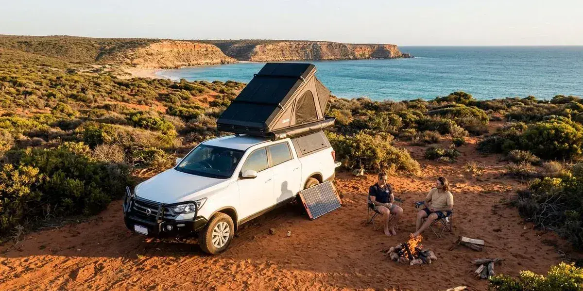 4WD camper parked at remote coastal campsite in Western Australia with no mobile towers visible showing the isolation of outback travel