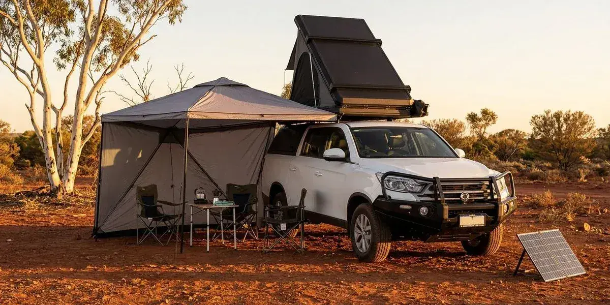 Fully equipped 4WD camper set up at a remote red dirt campsite in Western Australia