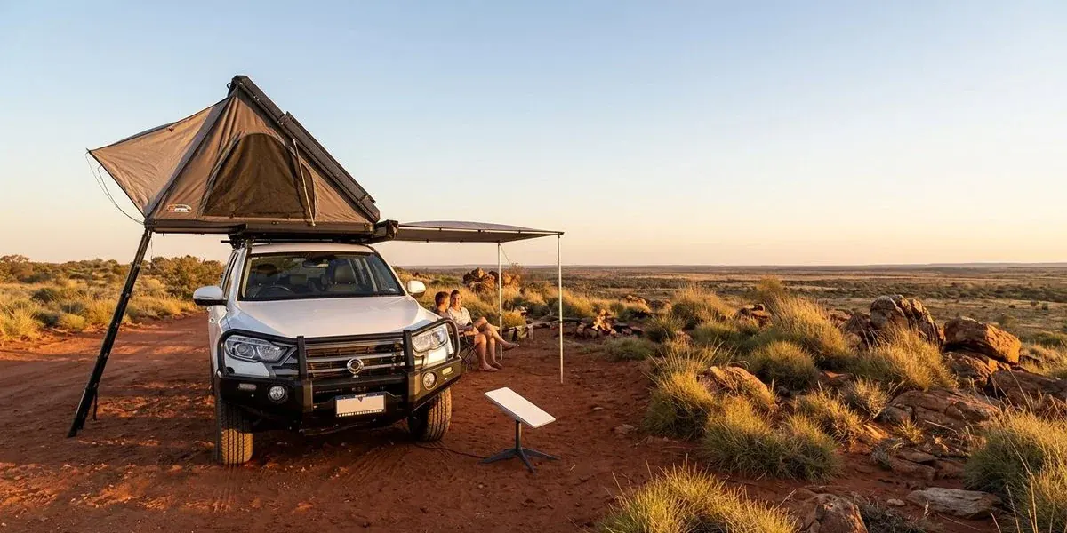 Starlink satellite dish set up at a remote red dirt campsite in Western Australia