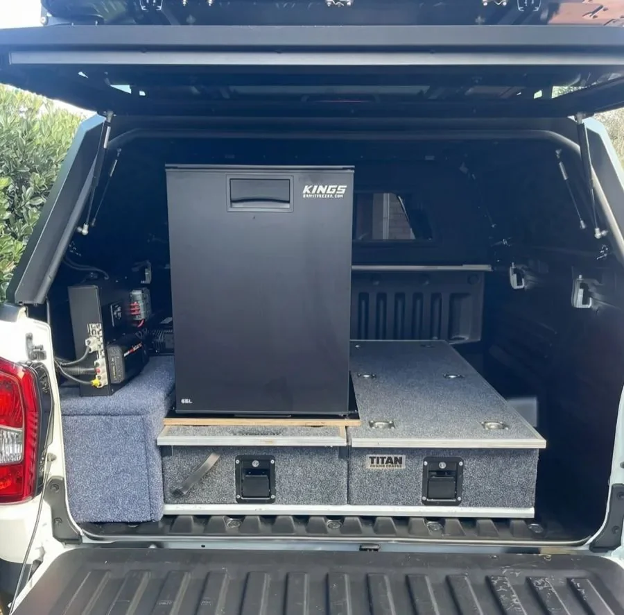 OFFGRID Wanderer 2.0 canopy interior showing Kings 65L fridge and Titan storage drawers