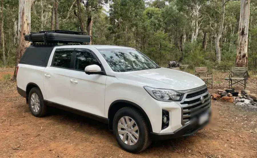 OFFGRID Wanderer 2.0 white KGM dual-cab ute parked at a bush campsite in Western Australia